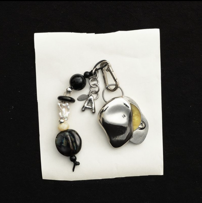 Everyday Talisman Keychain by Space of Time x Sea + Pattern: silver balm case on a handmade beaded charm keychain with letter charm