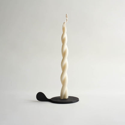 black candle holder with twisted off white candle